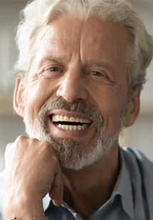 Man with dentures smiling